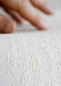 Hands over Braille dots